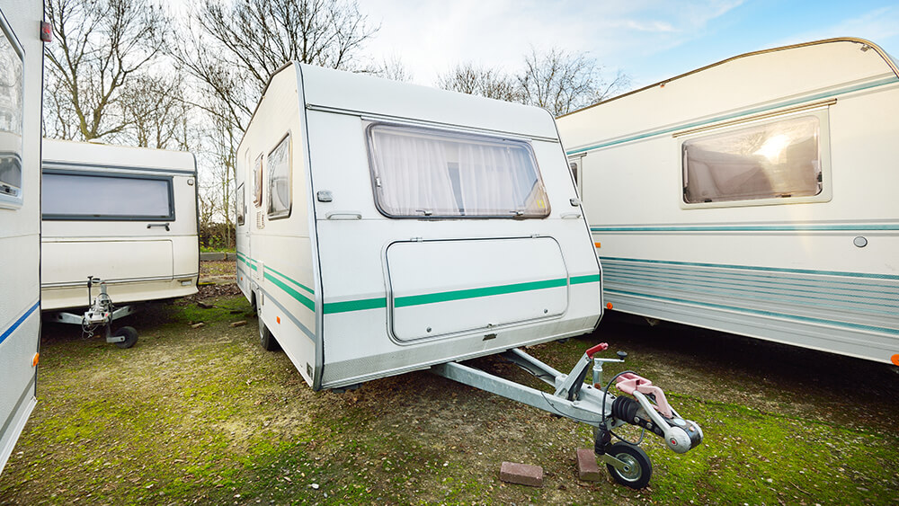 Caravan trailers parked on a green lawn. Winter caravans wanted north west united kingdom